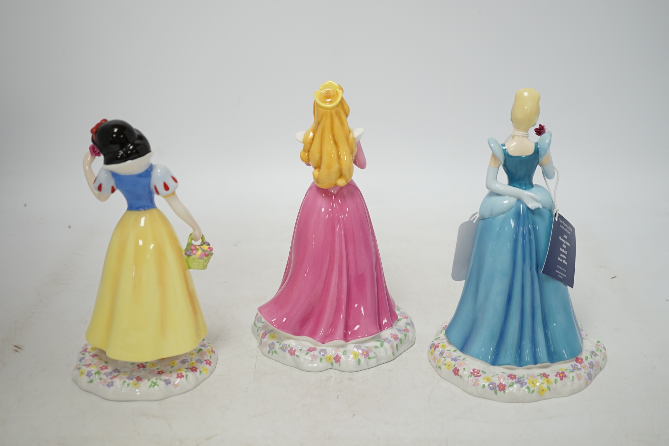 Three Royal Doulton Disney Showcase figures comprising, Cinderella, Sleeping Beauty and Snow White, with boxes and certificates, 19cm high. Condition - good